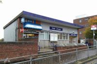 The ticket office and mandatory Irn-Bru outlet at Singer on 14 October 2017. Singer is a rare (unique?) example of a station name that is not a reflection of its location, in this case Kilbowie. At least Bellgrove is a street name.<br>
<br>
<br><br>[David Panton 14/10/2017]