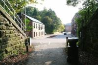 View from the eastern portal of Auchendinny Tunnel on a September morning in 2017, heading for Hawthornden Junction along the route of the former Penicuik Railway. The new housing stands on land once occupied by the Dalmore paper mill, closed in 2004. For the view back towards the tunnel [see image 61147].<br><br>[John Furnevel 27/09/2017]