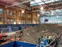 Nobody knows the rubble I've seen... Excavated matter from the Platform 12 extension temporarily piles up on the site of the Platforms 5/6 extension. Photographed 25 October.<br><br>[David Panton 25/10/2017]