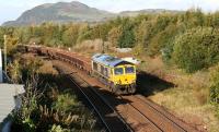 GBRf 66717 takes the right fork at Niddrie West Junction with a freight on 15 October 2017. The train is the 6K25 0730 Cambuslang - Millerhill SS ballast.<br><br>[John Furnevel 15/10/2017]