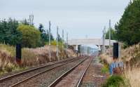 View east from the east end of Breich station showing masts. These have been erected approaching both sides of the station, but not through it,<br><br>[Ewan Crawford 08/10/2017]