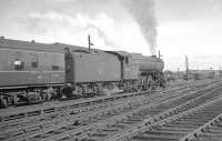 The 1.40pm Stranraer Harbour - Newcastle Central pulls away from Carlisle on 13 July 1963 behind V2 2-6-2 60975.<br><br>[K A Gray 13/07/1963]