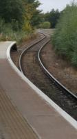 The track s-bends out of the station on its way to the former Forres West Junction. The route to Aviemore and the south was to the left of the platform and the new lines, laid on the original Inverness-Aberdeen route, can be seen in the distance.<br><br>[Crinan Dunbar 06/10/2017]