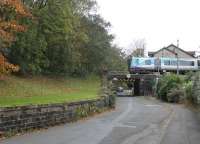 Bridge Road and Brunton Road in Lancaster, formerly crossed by an additional line leading to the old L&PJ station at Lancaster Greaves. The L&NWR built a two road engine shed and turntable in the fork between the two lines which was open from 1875 to 1934. In the trees on the left are traces of floor tiles and other remnants from the old depot. The grass bank near the surviving bridge is now a good vantage point for watching trains departing Lancaster [See image 35365]. 17th October 2017. [Ref query 30 October 2017]<br><br>[Mark Bartlett 17/10/2017]