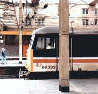 A northbound train stands alongside Carlisle platform 3 on 3 March 1993 behind InterCity liveried 86233 <I>'Sir Laurence Olivier'</I>.<br><br>[John Furnevel 03/03/1993]