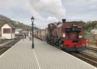 WHR loco number 138, an NGG16 Garrett, leaves Porthmadog for Boston Lodge with its empty coaches after bringing the afternoon train in from Caernarfon.<br><br>[Colin McDonald 18/10/2017]