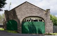 The trainshed of the original Newtyle station, viewed from the south, the direction of the original line approaching from [[Dundee Wards Road]]. The building later became a goods shed with the access to the platform inside to the left and tracks to the right.<br><br>[Colin Martin 24/06/2017]