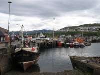 Flishing boats cluster on the north side of Mallaig Pier.<br><br>[David Spaven //]