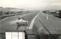 View east along the workers platforms at Singer on 18 April 1957. <br><br>[G H Robin collection by courtesy of the Mitchell Library, Glasgow 18/04/1957]