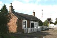 Attractively refurbished Dundee & Perth Railway crossing keeper's cottage (and fence) at Templehall, just west of the site of Longforgan station in the Carse of Gowrie. Photographed in December 2005 looking north west towards Castle Huntly.  <br><br>[John Furnevel 02/12/2005]