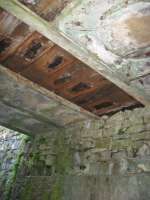 A photograph of the underside of a bridge which crossed over what I am pretty certain are the remains of a tramway used to haul the granite blocks quarried on the Ross of Mull up the hill to construct Glengorm Castle.<br><br>[Malcolm Chattwood //]