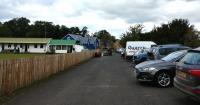 This is the railway formation just before Wooler Station. It is now used as the car park for the Bowling club which is on the left, a hive of activity with the annual laying away of the green taking place.<br><br>[Alan Cormack 07/10/2017]