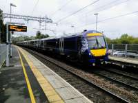 170471, on an Edinburgh to Glasgow service, calls at Croy on 14 October 2017. The days of diesels on this line are numbered, but how big is the number? It keeps<br>
changing...<br>
<br>
<br><br>[David Panton 14/10/2017]