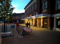 The street entrance to Central station offers a warm welcome on a spring evening. Notice the electric bikes in the foreground.<br><br>[Ken Strachan 15/04/2017]