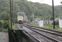 SNCB EMU 08574 comes off the single line section of the River Meuse bridge and approaches Anseremme station. The train is a local service heading from Dinant to Libramont on 8th September 2017. <br><br>[Mark Bartlett 08/09/2017]