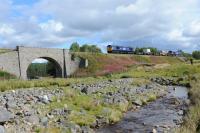 Nuclear flasks en route to Georgemas top and tailed by 66301 & 66302 south of Moy. 30th August 2017.<br><br>[Ian Millar 30/08/2017]