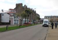 The site of the C&MLR station on the quayside in Campbeltown in October 2017. The two lines of the run-round loop were approximately where the central flower bed now sits. Of note is the Grade A listed Campbeltown Picture House, now nearing the end of a long restoration. This was built in 1913 and so witnessed the C&MLR trains operating until the 1932 closure of the railway. <br><br>[Mark Bartlett 22/10/2017]