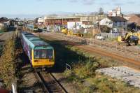 A Northern Class 142 has just departed from Kirkham and Wesham station (behind the photographer) with a service to Blackpool South and will turn south at Kirkham North Jct a short distance away. On the right a TPE Class 185 (on contract to Northern) is on a Blackpool North to Manchester Airport service.<br><br>[John McIntyre 27/10/2017]