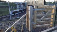 This rustic wooden gate looked a little incongruous beside the modern building and trams at Edinburgh Gateway on 5th November 2017. <br>
<br><br>[David Prescott 05/11/2017]