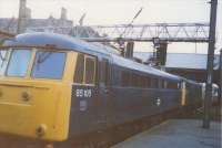 A double headed coal train passes through Preston Station in 1989. The front loco was 81017 and the second was 85105. Above them the signal shows a green aspect but also shows the letter F indicating the route set is over the Down Fast.(With thanks to Donald Hillier).<br><br>[Charlie Niven //1989]