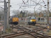 Old and brand new in the Down Loops at Carnforth on 3rd November 2017. 37422 was on RHTT duties but had arrived from Settle Junction almost two hours late and was waiting for the Leeds bound passenger service to clear the section before returning there. 88007 <I>Electra</I> was on a light engine test run from Carlisle and waiting for a path to return north. <br><br>[Mark Bartlett 03/11/2017]