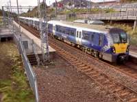 An Edinburgh service pulls into Livingston North on 24th October 2017. On the day<br>
this station opened, 31 years and 7 months previously, I stood on the far<br>
platform, then the only one. [see image 18408]. The scene is unrecognisable. Livingston South however still has the same temporary look that it had when it opened, around the same time.<br>
<br>
<br><br>[David Panton 24/10/2017]