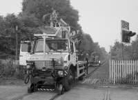 Road-Rail hedge trimmer on a demonstration run at Causewayhead on the then closed Stirling  - Alloa line in 2000.<br>
<br>
<br><br>[Bill Roberton //2000]