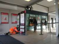 Tamworth Railway Station booking hall on 17th November 2017. The chap in high viz clothing is covering up all the London Midland branding. Obviously he didn't want anyone tripping over him.<br>
<br>
<br><br>[Alan Cormack 17/11/2017]