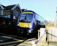 Up close and personal. An Edinburgh to Inverurie service pulls out of<br>
Broughty Ferry and over the level crossing on 25th October 2017. The service here is not great, though better than the token one it had for many years. It suffers, like Invergowrie, for being a suburban location with no suburban service. Broughty Ferry and Invergowrie will have an hourly service from May 2019.<br>
<br><br>[David Panton 25/10/2017]