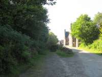 A photograph of what I am pretty certain are the remains of a tramway used to haul the granite blocks quarried on the Ross of Mull up the hill to construct Glengorm Castle.  The line would have continued  behind the photographer up to a headshunt and then up to the castle site.  Unfortunately the construction of the castle pre-dates the map edition so only a line of the track is shown. I haven't managed to find <br>
any reference to a tramway but there's a lot of granite in that castle!<br>
<br><br>
<a target=external href=http://maps.nls.uk/geo/explore/#zoom=18&lat=56.6420&lon=-6.1859&layers=168&b=1 >North end</a><br><br>
<br>
<a target=external href=http://maps.nls.uk/geo/explore/#zoom=17&lat=56.6364&lon=-6.1750&layers=168&b=1 >South end, Glengorm Castle</a><br><br>
<br><br>[Malcolm Chattwood //]