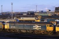 Depot Visit Memories - early morning at Cardiff Canton on 4th June 1990. In the Foreground is 47473, later withdrawn and cut up at Crewe Works in 1998. Behind this is 37427, which later worked on West Highland services. Withdrawn in 2006 it was sold to DRS as a source of spares and cut up in 2013.<br>
<br><br>[Graeme Blair 04/06/1990]