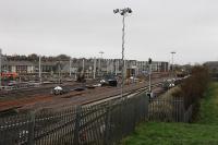 Electrification work at Blackpool North carriage sidings where a new washing plant can be seen on 21st November 2017. A single track is in place on the main line for materials removal and Freightliner 66597 is at the head of a spoil train. The first point has been laid and it looks like the severe speed restriction at the old station throat is going to be eased considerably. <br><br>[Mark Bartlett 21/11/2017]