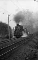 An early evening freight hauled by a DB 2-8-2 no. 042-271, heads west towards Osnabruck at Bruchmuhlen in April 1976.<br><br>[John McIntyre /04/1976]