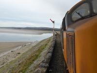 The view onto the Kent viaduct as 37402 passes the Arnside advance starter with 2C47, Preston to Barrow-in-Furness on 13th November 2017.<br><br>[Mark Bartlett 13/11/2017]