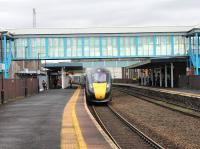 The 0645 Paddington to Swansea departing from Neath on 16th November 2017. A 10 coach Class 800 set is too long for the platform here and passengers in the back two coaches have to move forward to exit the train. There appeared to be extra crew training taking place to assist with this and teething issues, like the doors of one coach not working. <br>
<br><br>[Alastair McLellan 16/11/2017]