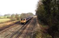 Network South East EMUs, with 7001 leading, heading west on the approach to Basingstoke on 26 February 1992.<br><br>[John McIntyre 26/02/1992]