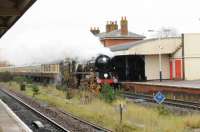 35028 <I>CLAN LINE</I> racing through Andover station at 1240hrs on a very wet Saturday 18th November 2017.  The train was <I>The Wessex Express</I> from London Victoria to Eastleigh.  <br>
<br><br>[Peter Todd 18/11/2017]