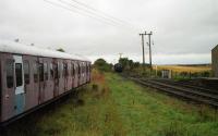 A view towards Kinnaber Jct from the end of the station area at Bridge of Dun in August 1992. Not quite how it once was with the Aberdeen to Glasgow expresses passing.<br><br>[John McIntyre 09/08/1992]