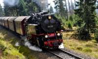 HSB 99 222 with the 12:45 train from Drei Annen Hohne to Brocken at Goetheweg on 18 September 2017.  This shot was taken from the 13:14 train from Brocken to Drei Annen Hohne, sitting in the passing spur.  Pre-war there was also a station here, for the benefit of hikers of the Harz Club.  This locomotive features on the tickets for the Wernigerode-Brocken service - [See image 61799], and as Bill Jamieson pointed out, is rather special with it's cylindrical feed-water heater - in late DDR days it looked very much like the other 2-10-2Ts as it had been fitted with the same type of heater as them.<br><br>[Norman Glen 18/09/2017]