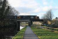 37401 brings the 2C47 Preston to Barrow service to a stand on the Lancaster Canal bridge as it waits for Platform 3 to clear in Lancaster station. 24th November 2017 <br><br>[Mark Bartlett 24/11/2017]