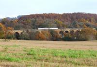 The 1054 Edinburgh - Tweedbank illuminated by the Autumn sun as it crosses Newbattle Viaduct on 23 November 2017 midway between Eskbank and Newtongrange.<br><br>[John Furnevel 23/11/2017]