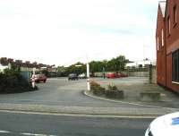 Entrance to the former Pilton Yard, Barnstaple, looking east from the A93 Pilton Causeway on 5 June 2002. Once the main depot and operating centre of the Lynton and Barnstaple Railway, passenger services were provided from the opening of the line in 1898, although from 1904 until closure in 1935 these were retained for the use of staff only. The former carriage and locomotive sheds were destroyed by fire in 1992 and much of the site is now used as a car park. [Ref query 28 November 2017]  <br><br>[Ian Dinmore 05/06/2002]