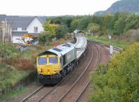 Freightliner 66952 brings up the rear of a freight from Millerhill south sidings about to run through Niddrie West Junction on the morning of Sunday 8 October 2017. The concrete sleepers are destined for Keith.<br><br>[John Furnevel 08/10/2017]