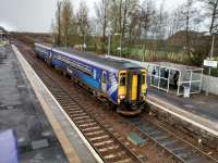 A Glasgow to Edinburgh semi-fast calls at West Calder carrying Black Friday<br>
shoppers on 24 November. Photographed from the fine lattice footbridge<br>
(Hanna, Donald & Wilson. Paisley) which is doomed by the monstrous,<br>
accessible, OHLE-ready version under construction behind me. The crossover<br>
is used on Sundays to reverse the two-hourly service to/from Edinburgh.<br>
<br>
<br><br>[David Panton 24/11/2017]