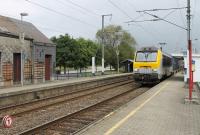 A SNCB freight, hauled by electric loco 1317, heading north towards Dinant passes through Paliseul station on 6th September 2017. Although it has a reasonable service of trains, unstaffed Paliseul had a BR 1970s feel about it with two basic shelters and a disused former railway building falling into disrepair.  <br><br>[Mark Bartlett 06/09/2017]