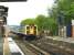 A train for Waterloo arriving at Woking platform 1 on 3 May 2002.<br><br>[Ian Dinmore 03/05/2002]