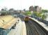 View south from the footbridge at Poole station on 3 May 2002 as a Weymouth - Waterloo train leaves plattform 1.<br><br>[Ian Dinmore 03/05/2002]