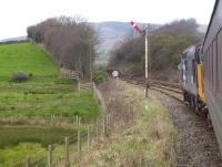 Immediately north of Foxfield station the railway swings sharply to the west to cross the Duddon Estuary before turning south for Millom. 37401 is just passing the Foxfield Advance Starter with the 2C49 Barrow to Carlisle service on 13th November 2017. The bridge over the Duddon is just beyond the small cutting seen here. <br><br>[Mark Bartlett 13/11/2017]