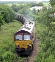 EWS 66155 climbs away from Thornton Yard in 2005 with empties for Westfield Open Cast Mine with the locoshed roof in the background.  Stocks were being cleared from the site. [Ref query 6 December 2017]<br><br>[Bill Roberton //2005]