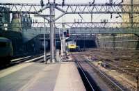 A Class 86 electric locomotive approaching the end of its journey as it arrives at Euston on 20 March 1976.<br><br>[John McIntyre 20/03/1976]